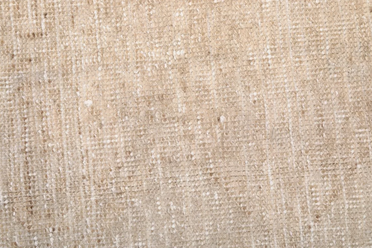 Close-up of the low wool pile, showing the hand-knotted texture and vintage wear