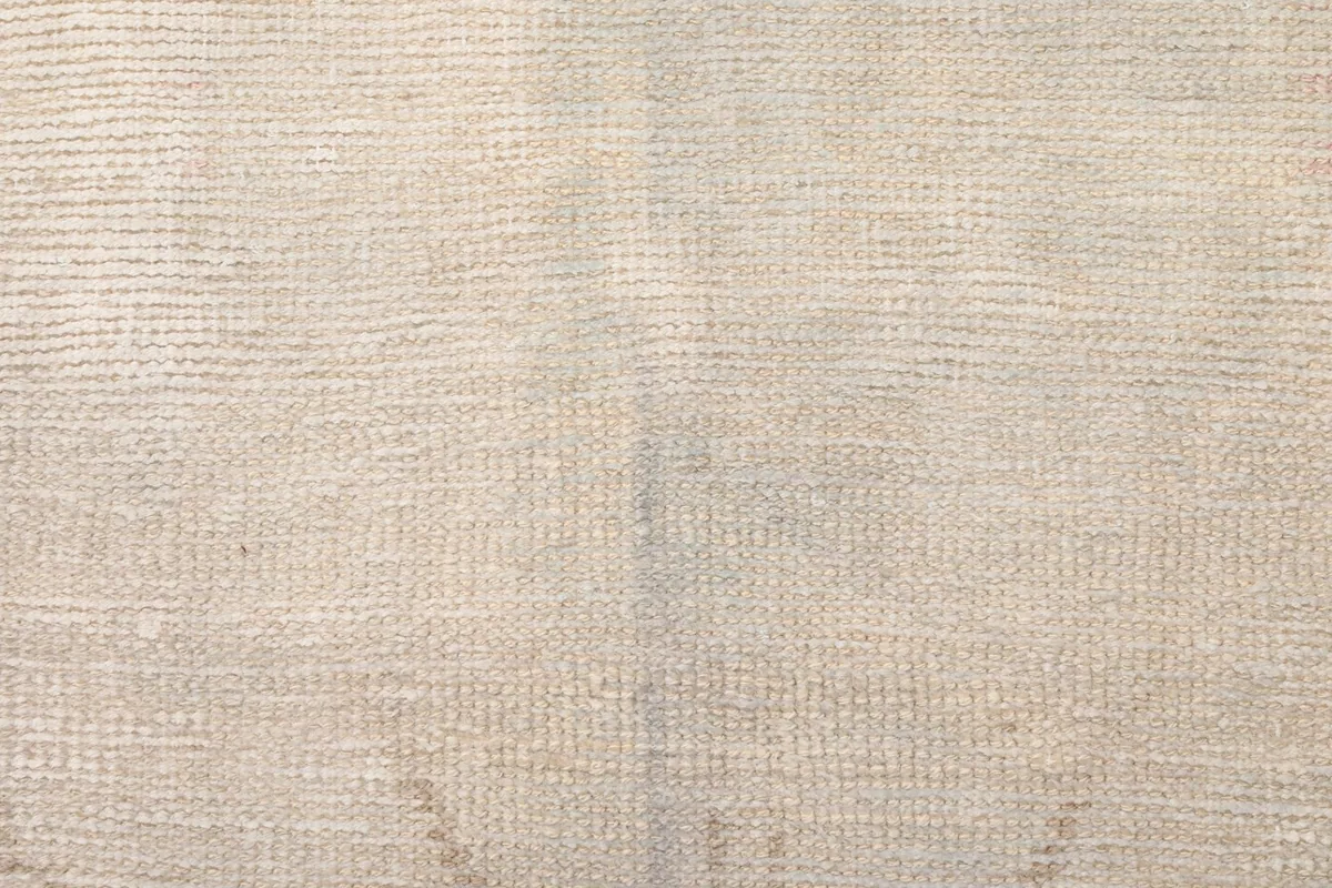 Texture detail of the hand-knotted wool pile, showing the tight weave and low height.