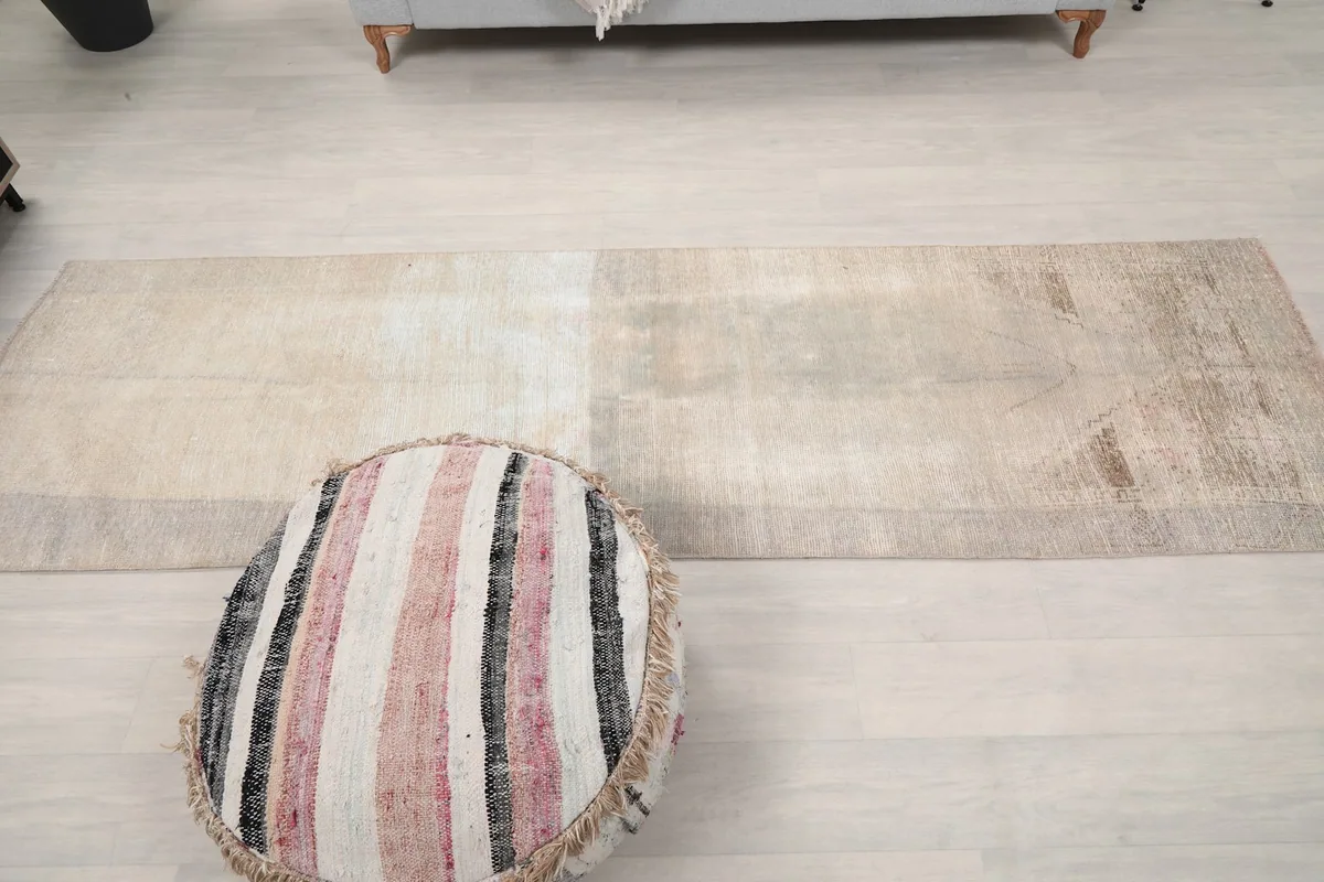 Full overhead view of the runner rug in the room, showing its elongated shape and design.