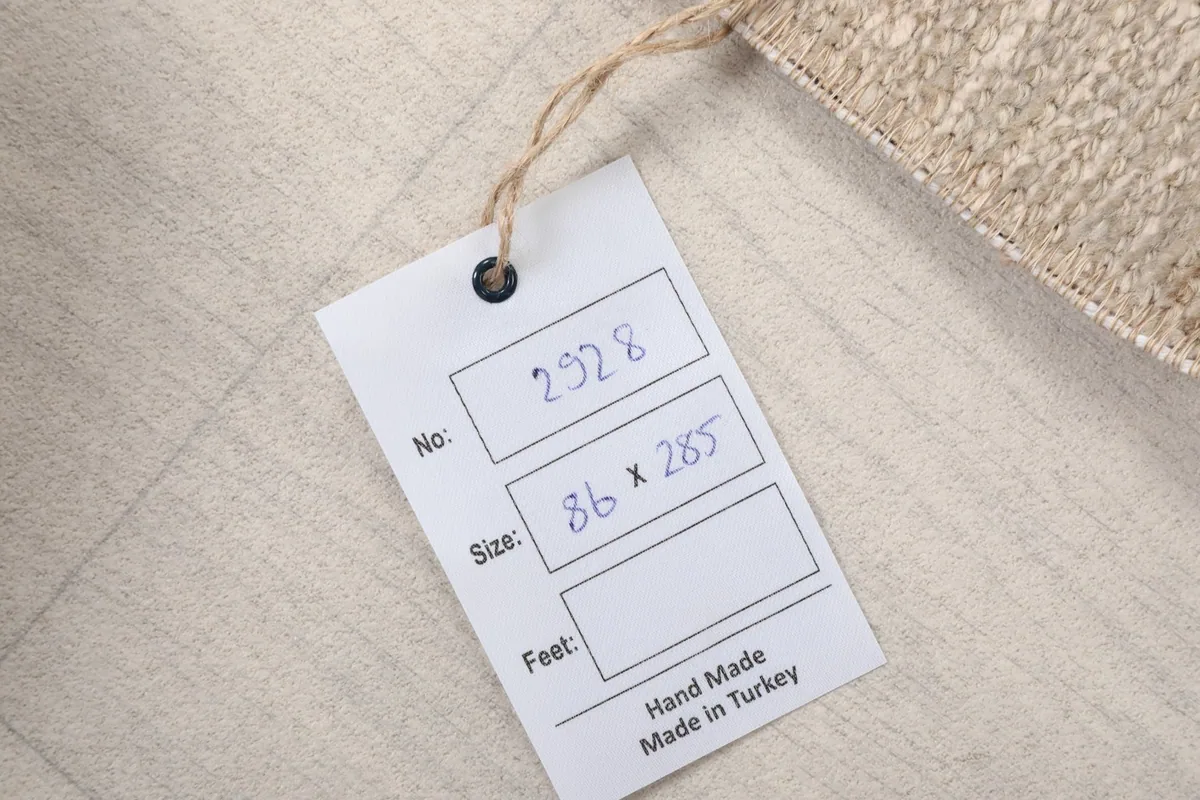 Tag showing the rug's product number and dimensions in centimeters, confirming origin from Turkey.