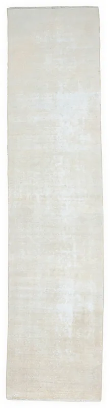 Full overhead view of the beige distressed runner rug on a white background