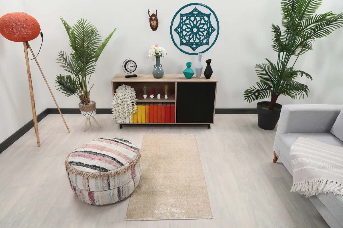 Faded Beige Geometric Anatolian Rug in a modern living space, showing its size and placement.