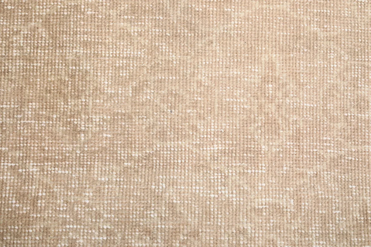 View of the low pile and intricate knotting of the Faded Beige Geometric Anatolian Rug.