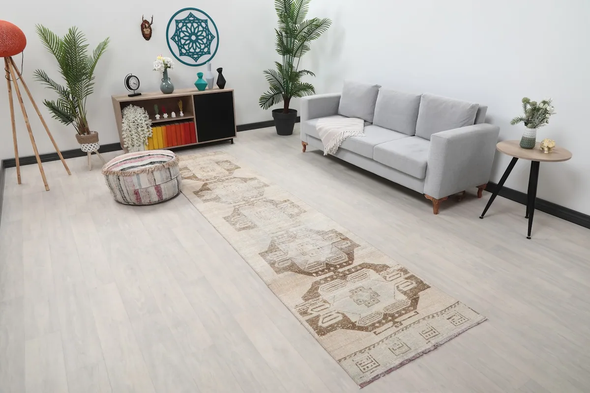 Angle view of the runner rug in a room, highlighting its length and placement next to furniture.