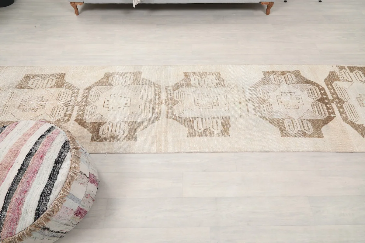 Overhead view of the runner rug, capturing its entire length and design on a light floor.