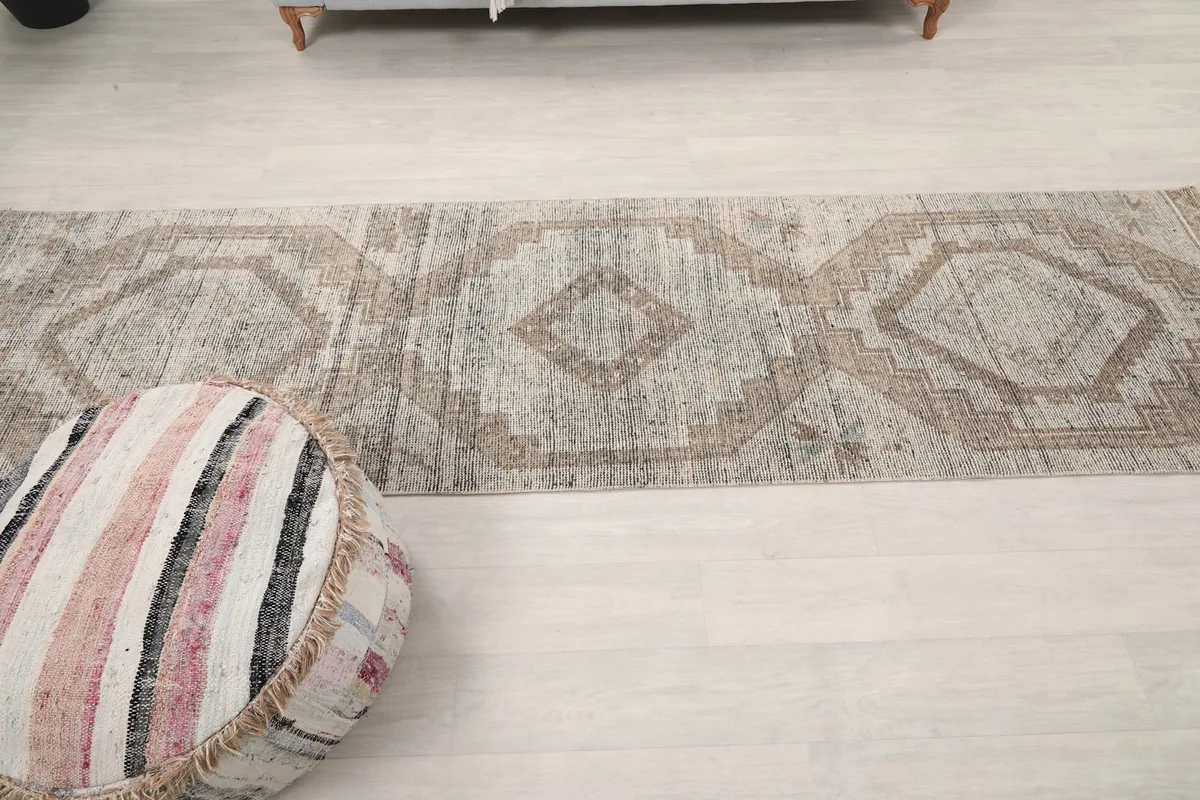 Overhead shot of the runner, focusing on the repeating geometric motifs along its length.