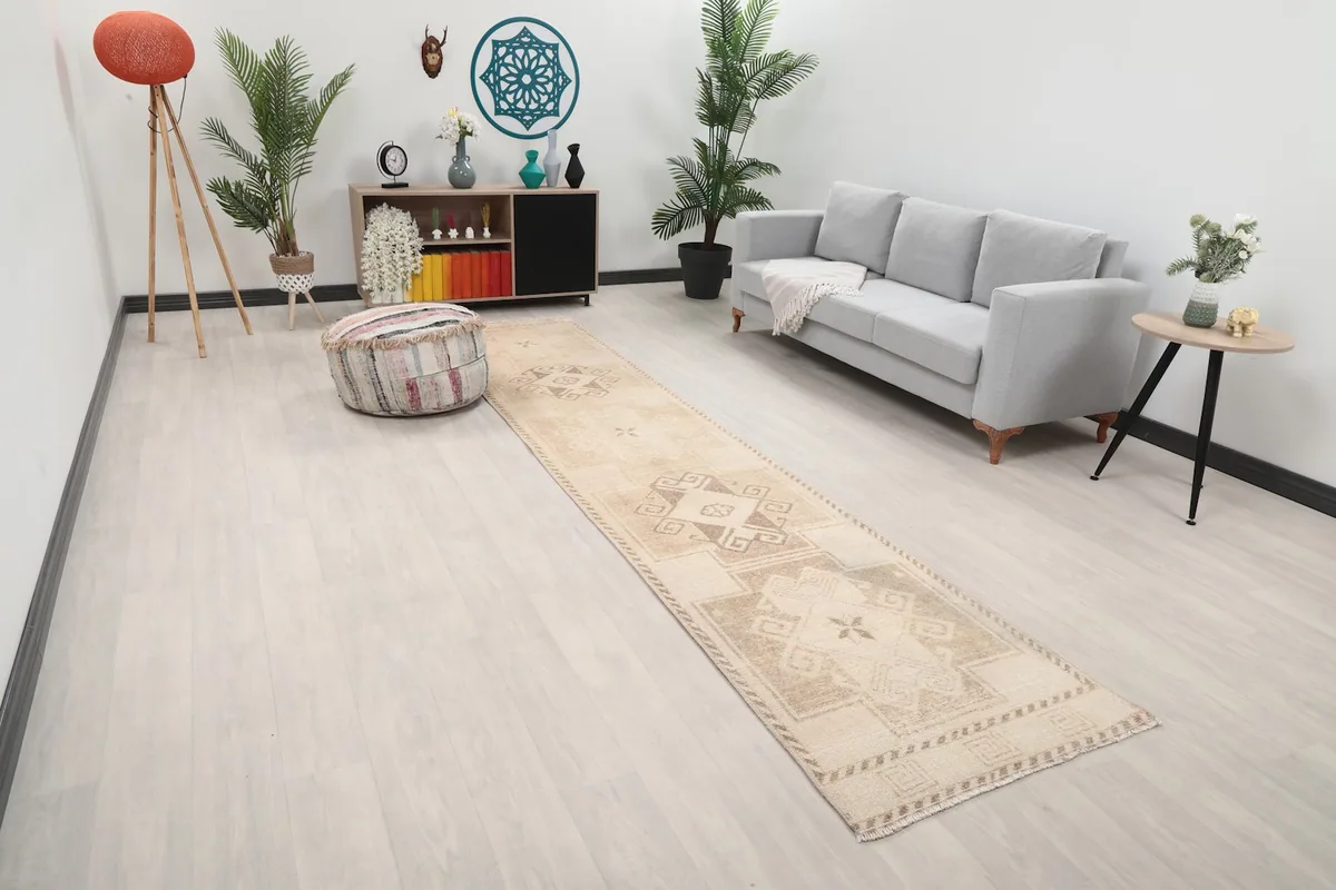 Angle view of the Anatolian runner rug extending down a hallway with modern decor