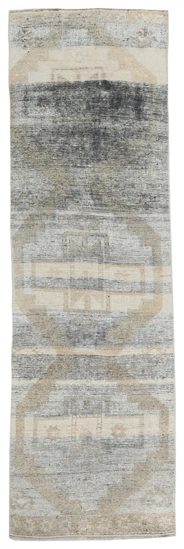 Full top view of the 2'11" x 10'7" charcoal and beige geometric vintage runner