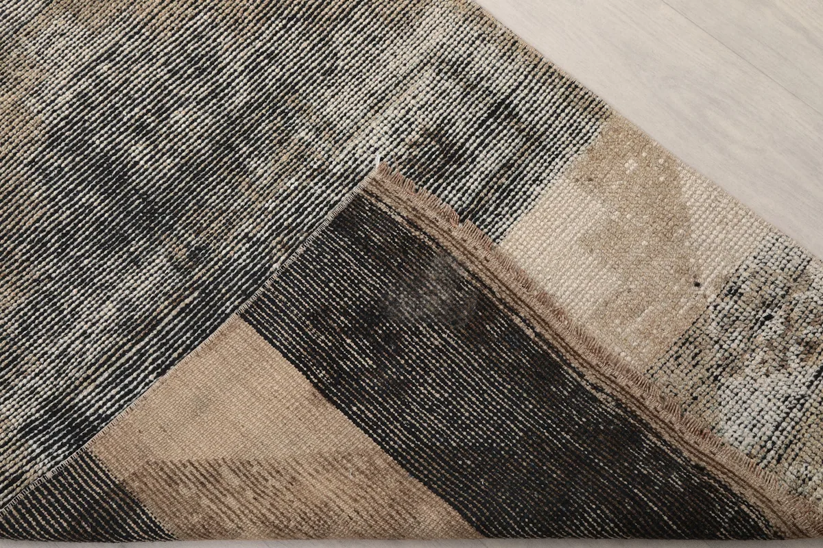 Underside view of the hand-knotted cotton foundation and wool pile