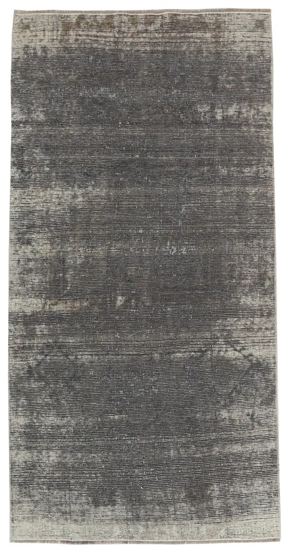 Full overhead view of the charcoal and gray distressed vintage Anatolian rug