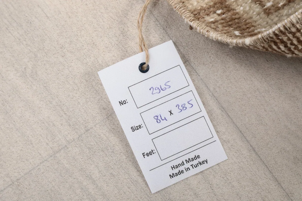 Product tag indicating the rug's origin (Turkey) and size in centimeters