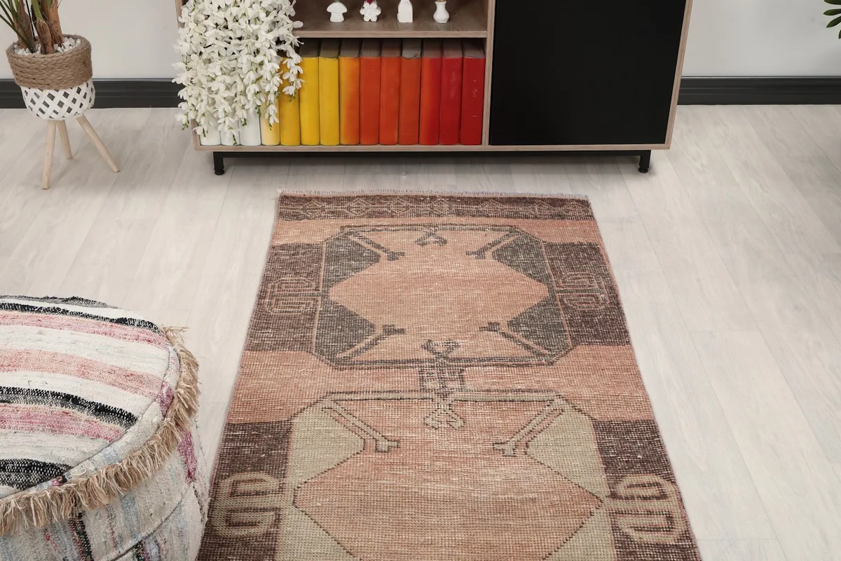 Overhead view of the runner rug's pattern in a room, showing its length and design