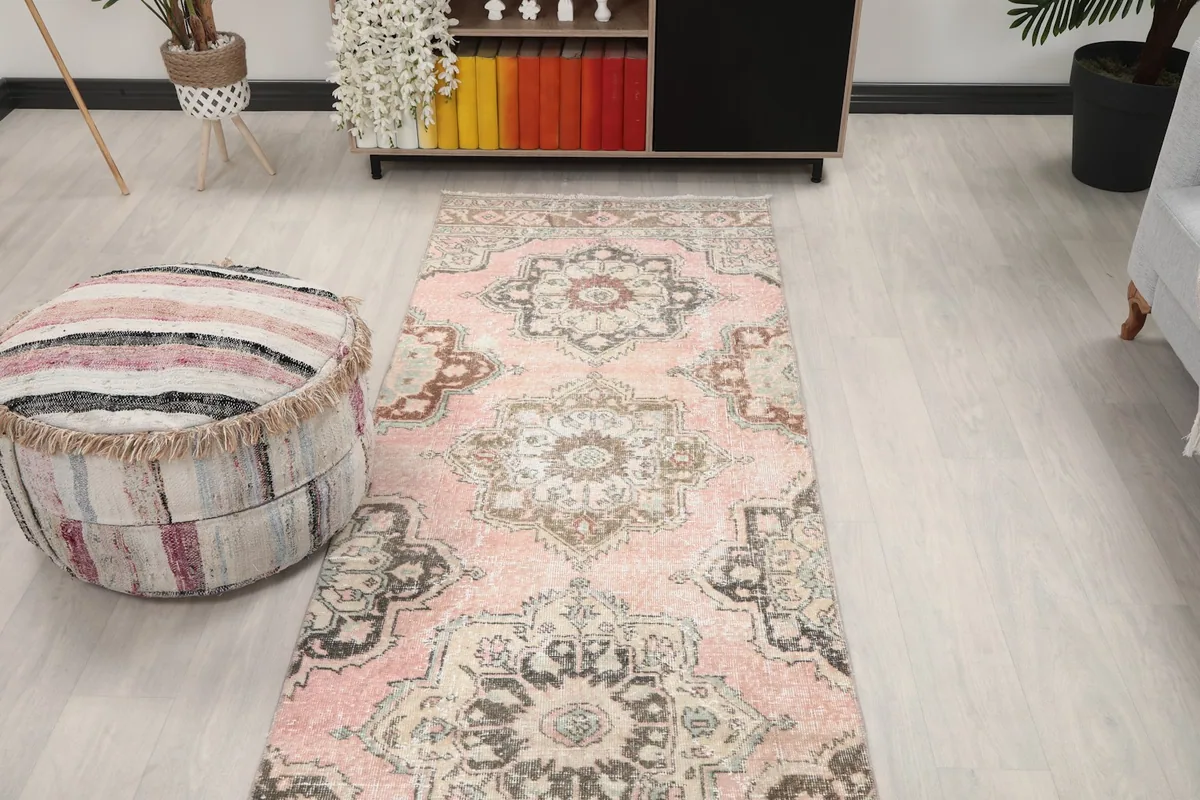Overhead view of the rose runner rug in a room setting, highlighting its full pattern