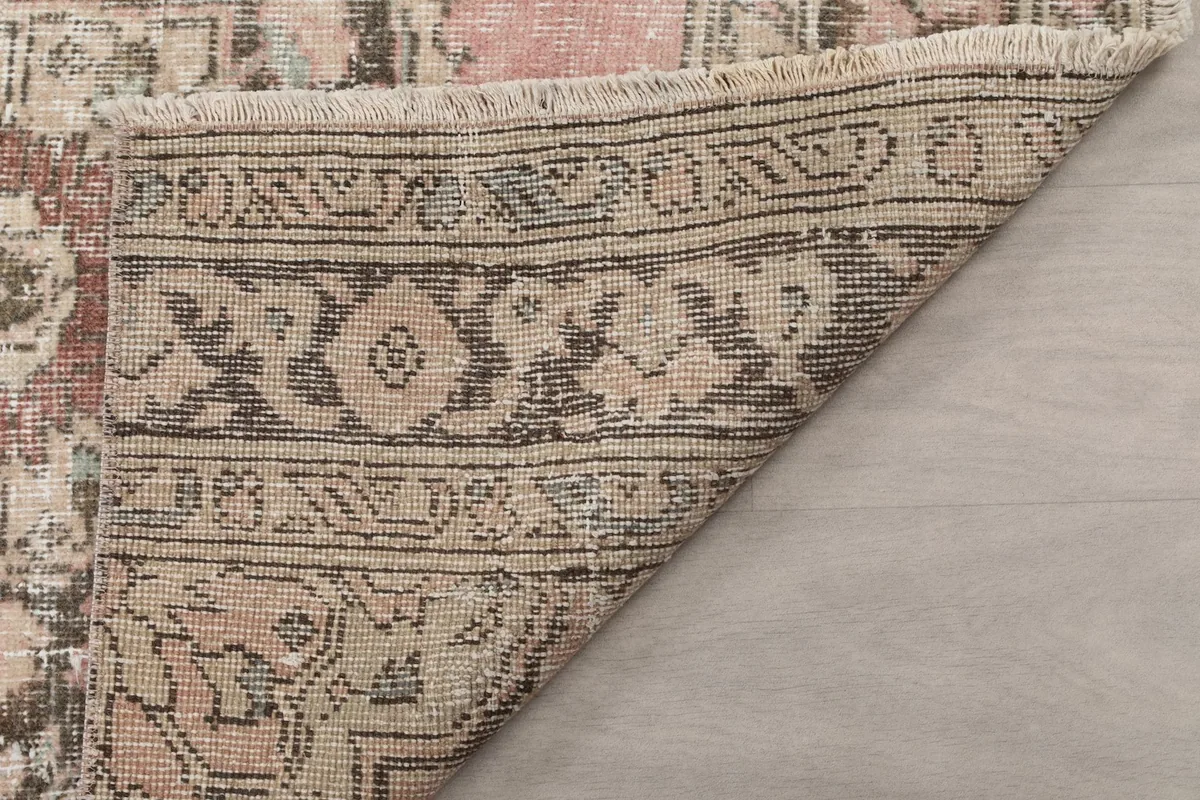 Detail of the rug's back and foundation, showcasing the hand-knotted construction