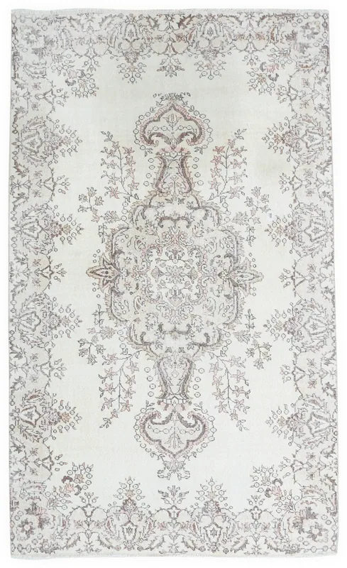 Full overhead view of the ivory and rose floral medallion vintage rug