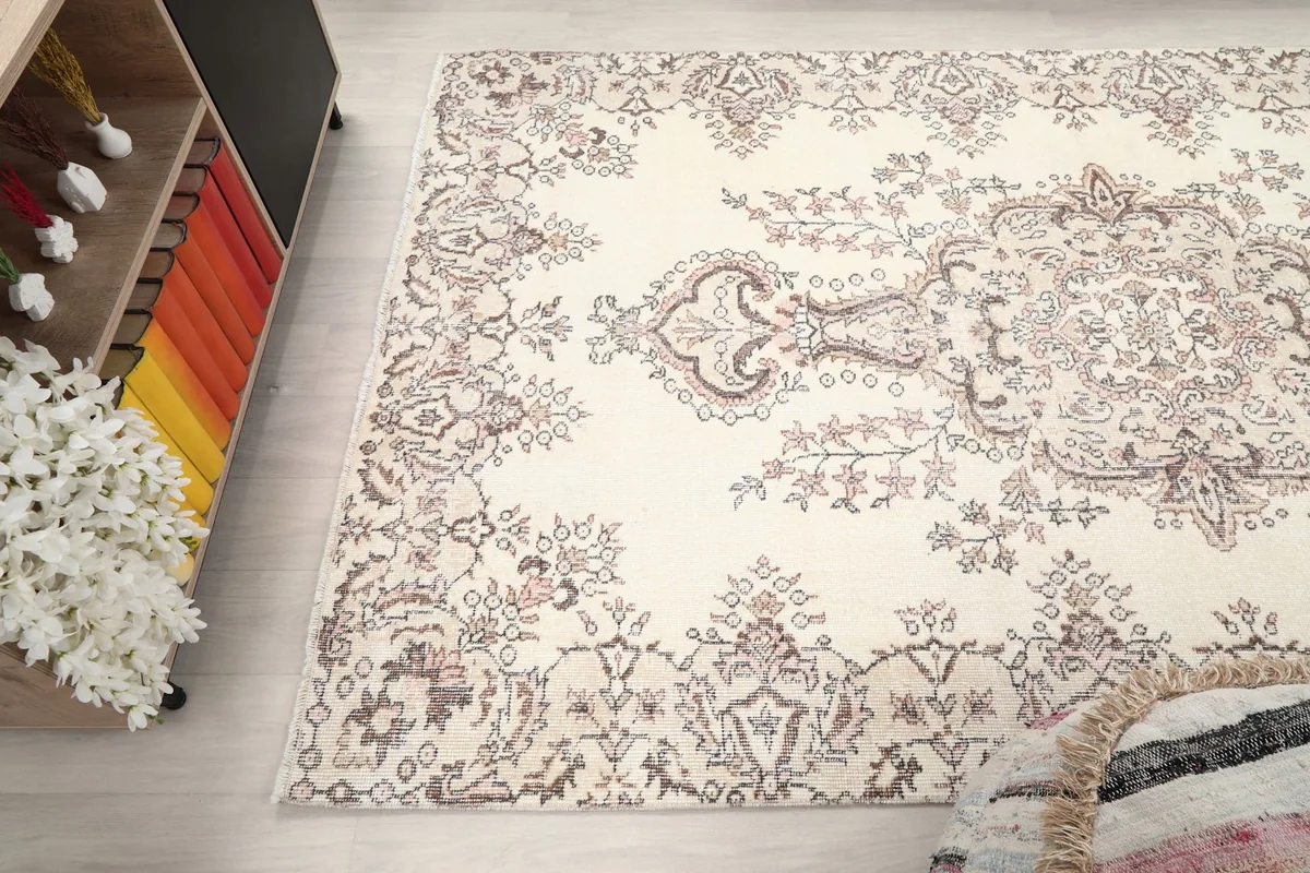 Overhead angle of the vintage rug showing its full design and colors