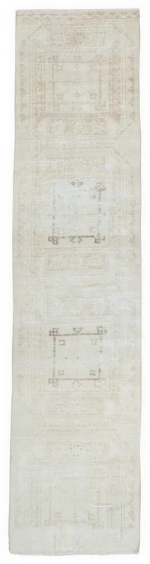 Full top view of the 2'6" x 10'8" beige vintage Anatolian runner rug on a white background.
