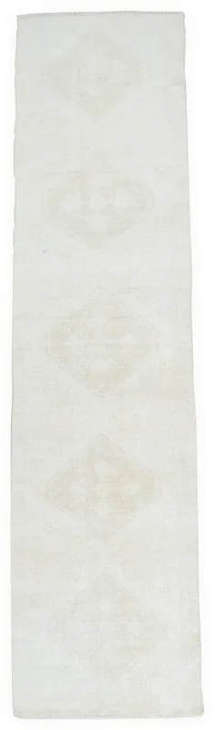 Full overhead view of the 2'8" x 11'7" ivory and tan Anatolian vintage runner rug