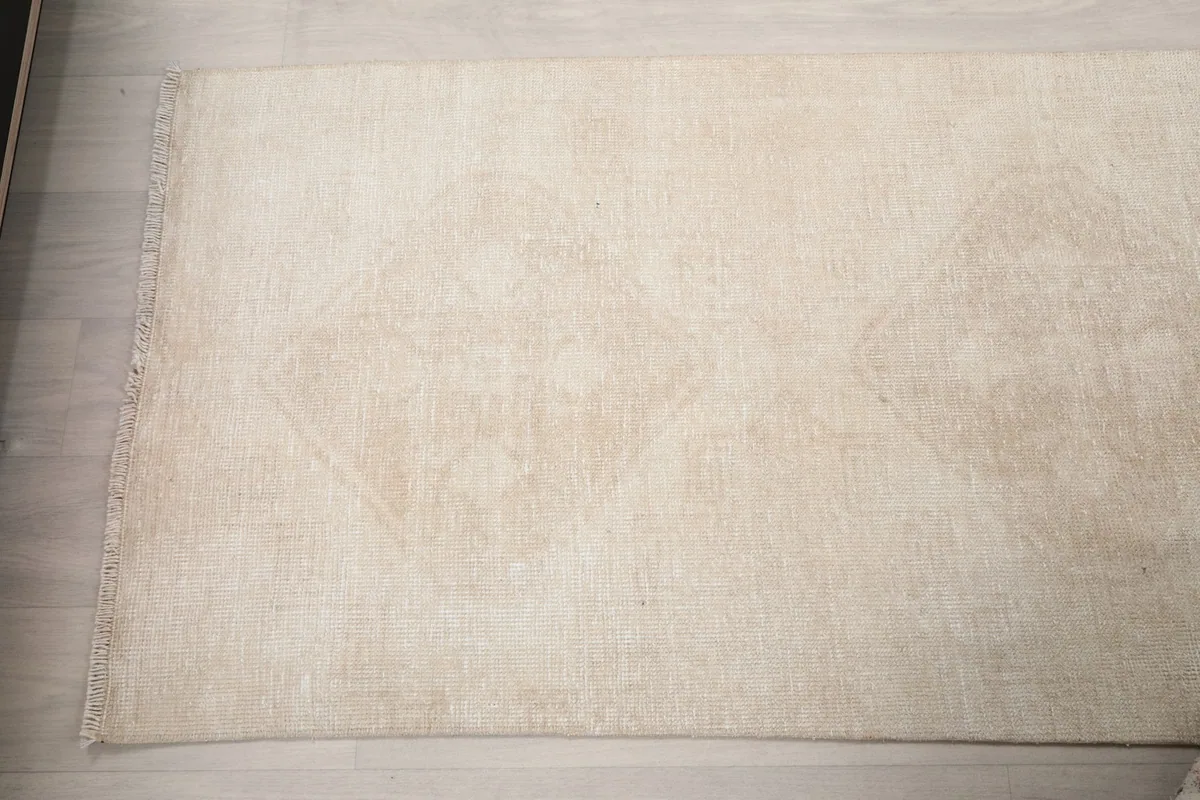 Top-down view of a section of the runner, displaying multiple faded geometric medallions