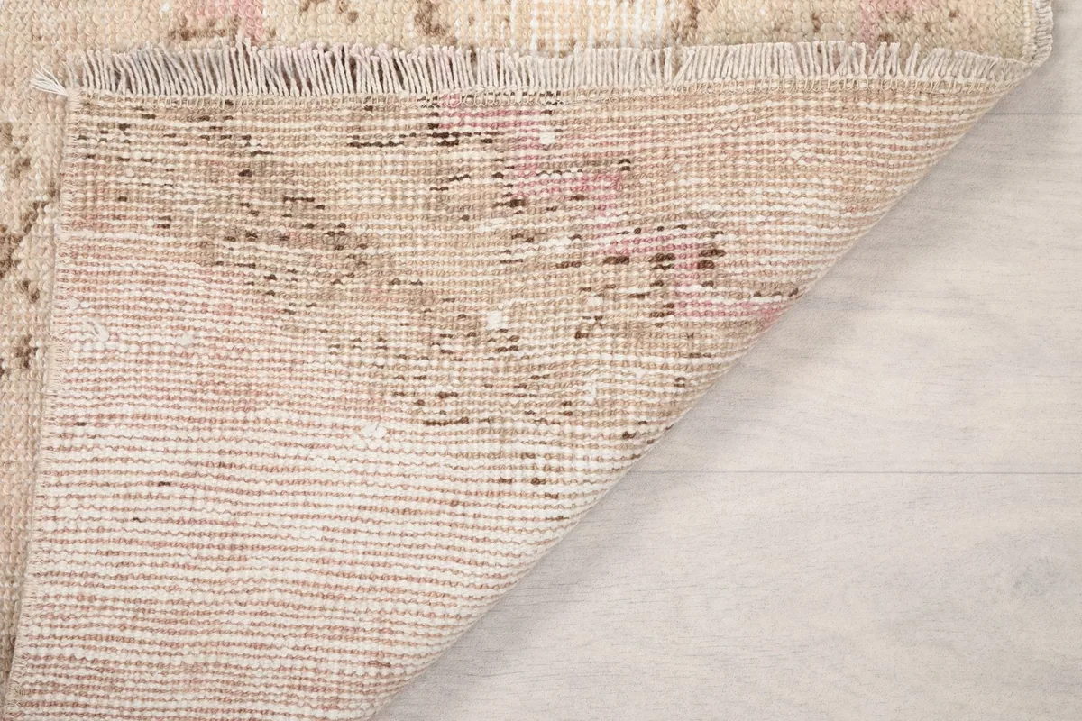 Underside of the hand-knotted rug revealing the cotton foundation