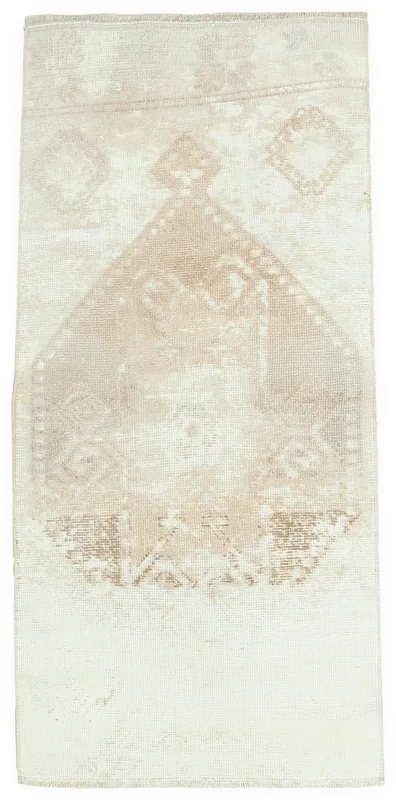 Full overhead view of the vintage ivory and tan geometric Anatolian area rug