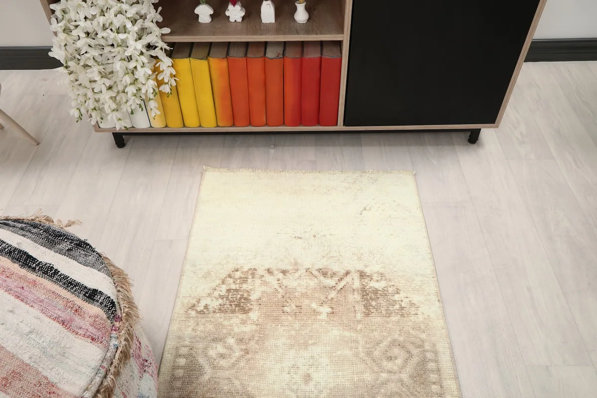 Overhead view of the rug on the floor, showing its full length in a room environment