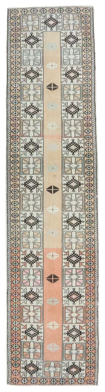 Full overhead view of the 2'6" x 9'5" vintage Anatolian runner rug with tan and rust colors.