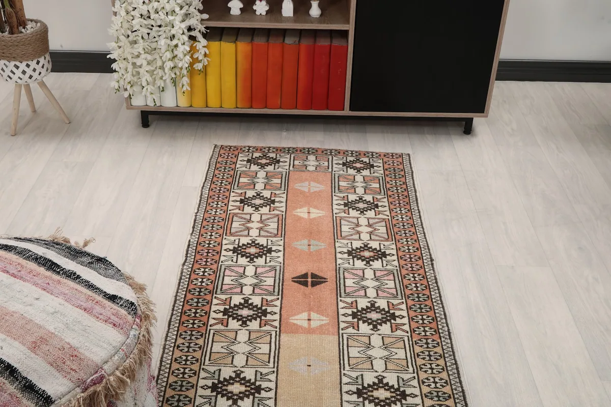 Runner rug in a room, providing a perspective of its design and color palette.