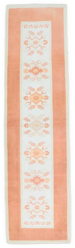 Full top view of the 2'9" x 9'0" orange and ivory geometric runner rug on a white background.