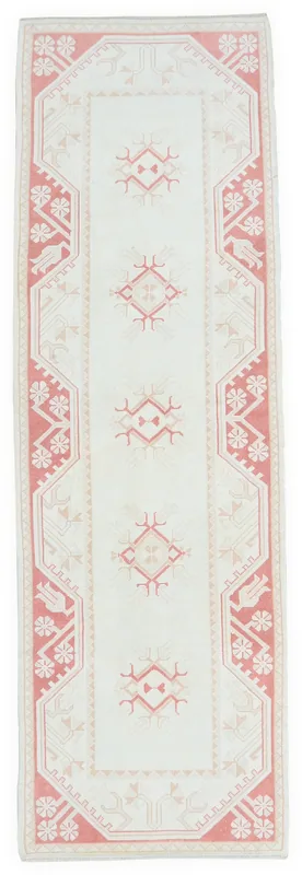 Full overhead view of the vintage Anatolian runner with cream field and rose geometric patterns
