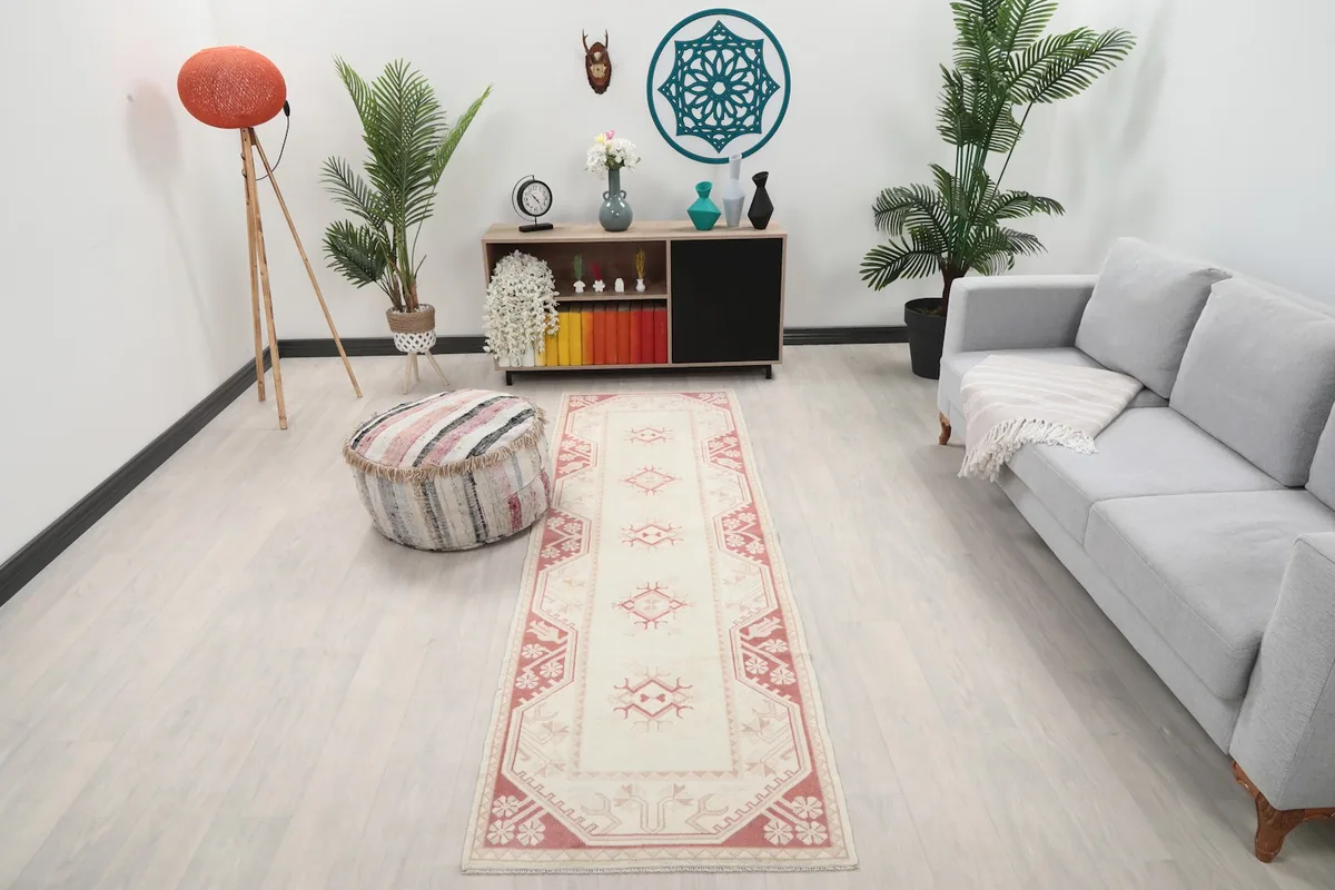 Vintage runner displayed in a living room setting, showing its length next to a sofa