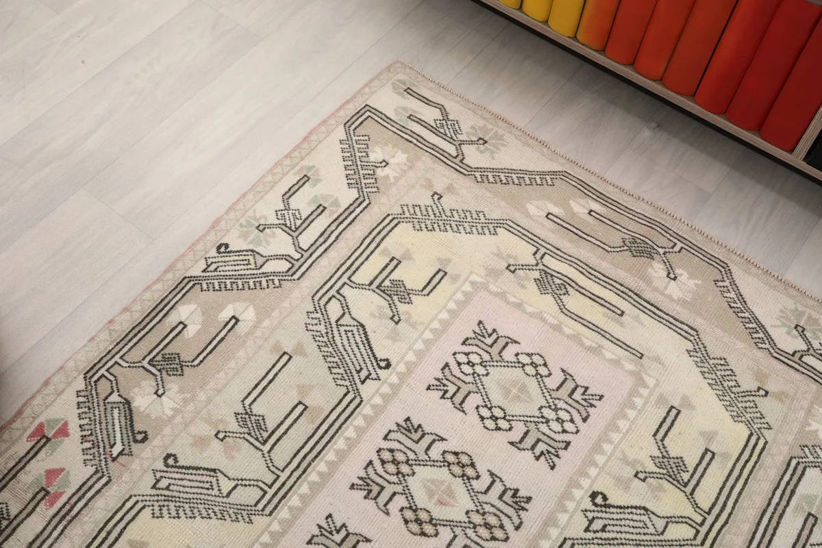 Upper corner of the rug, showing the intricate border and field patterns.