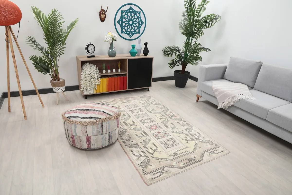 Angle view of the ivory and beige rug placed in a modern living room setting.