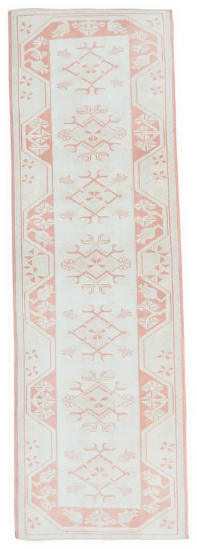 Full top view of the 2'8" x 8'8" rose and ivory Anatolian runner rug