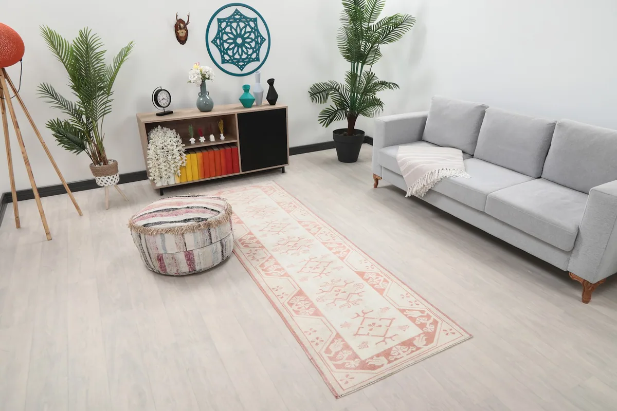 Angle view of the runner rug in a room with light furniture