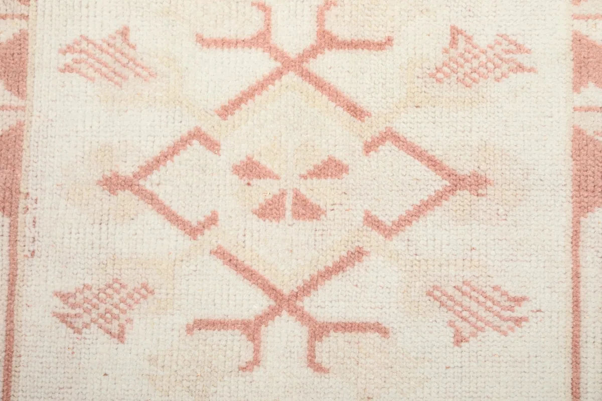 Close-up of the hand-knotted wool pile and geometric motifs