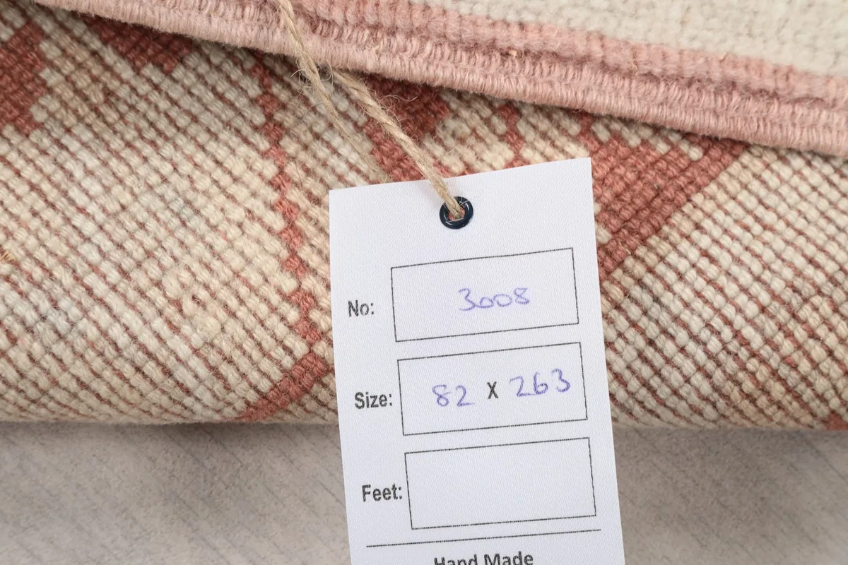 Back of the rug with a size tag showing 82 x 263 cm dimensions
