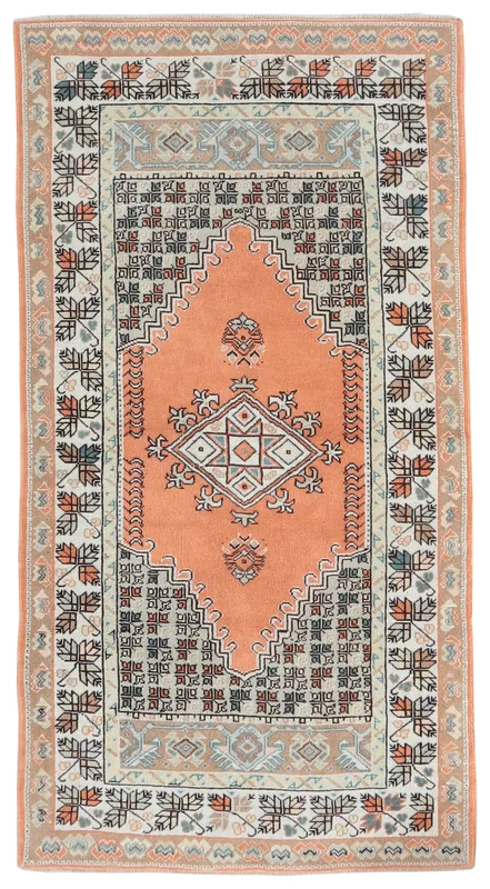 Full top view of the 3x6 orange vintage Anatolian area rug with a central medallion