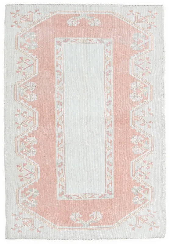 Full overhead view of the 4'0" x 6'4" vintage rose and ivory geometric Anatolian rug on a white background.