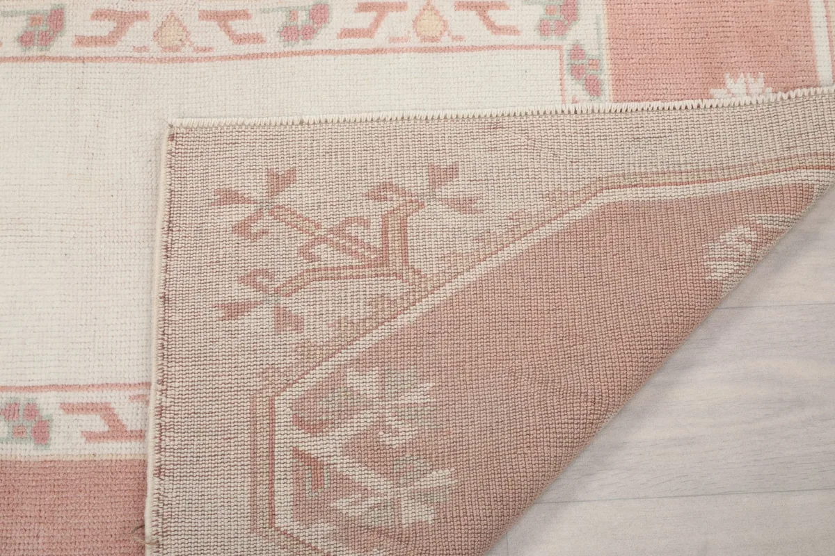 Close-up of the back of the rug, showing the quality of the hand-knotting and material.