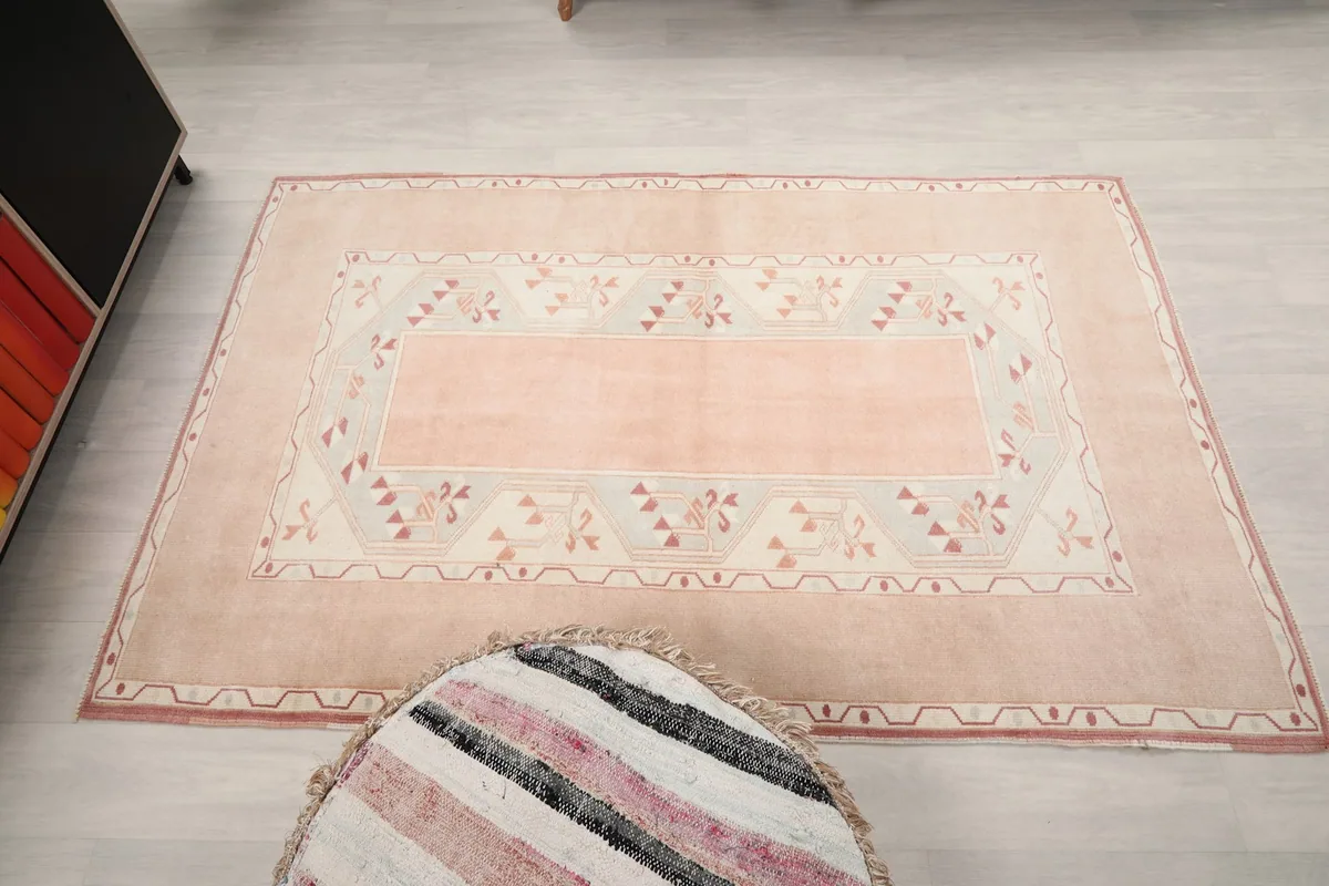 Overhead view of the rug in the room, showing its full shape and pattern