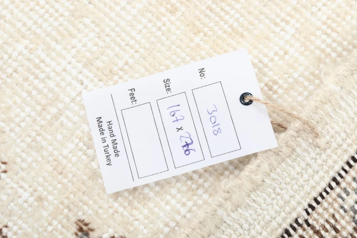 Product tag on the back of the rug indicating size and origin