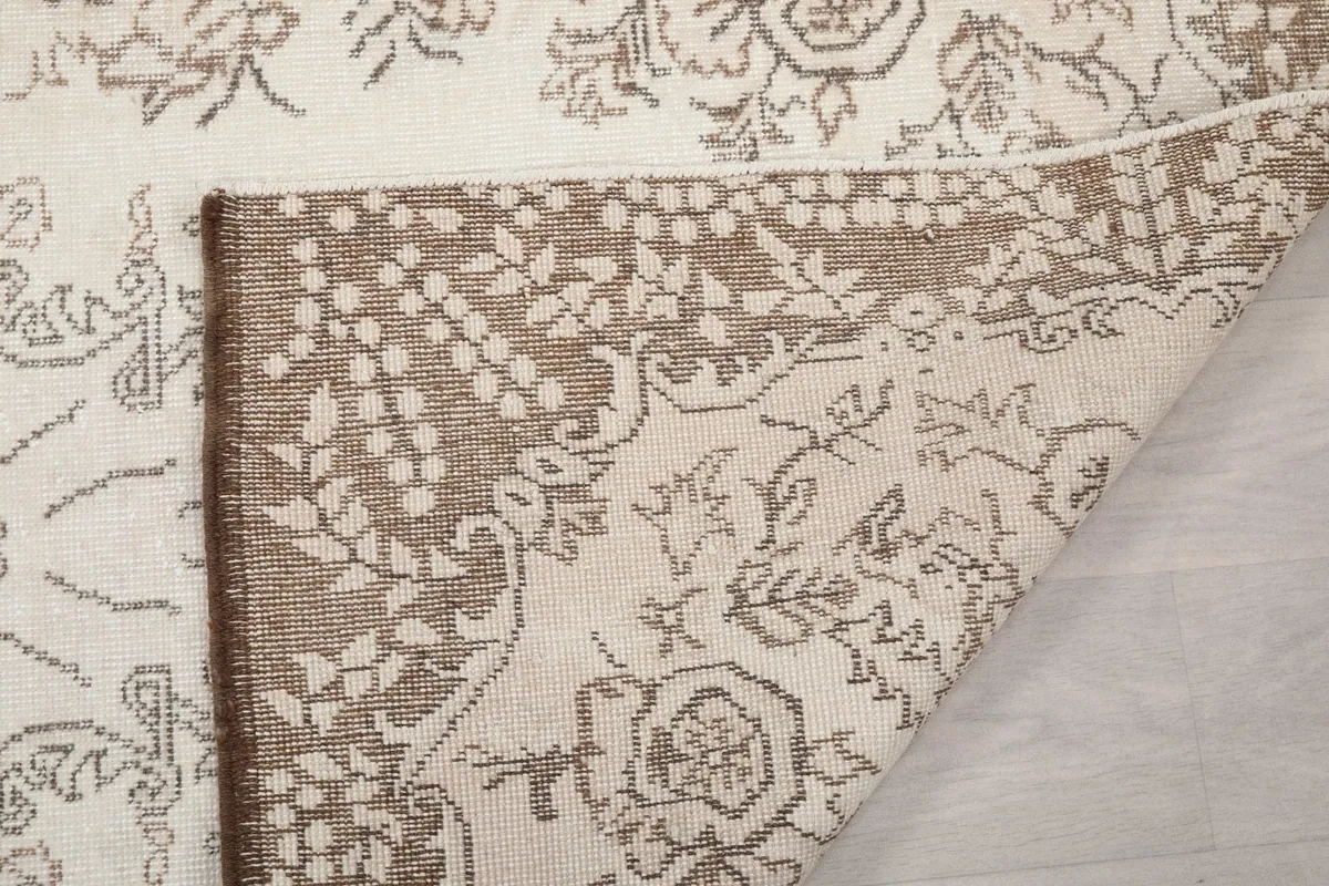 Close-up of the rug's back, showing the hand-knotted construction
