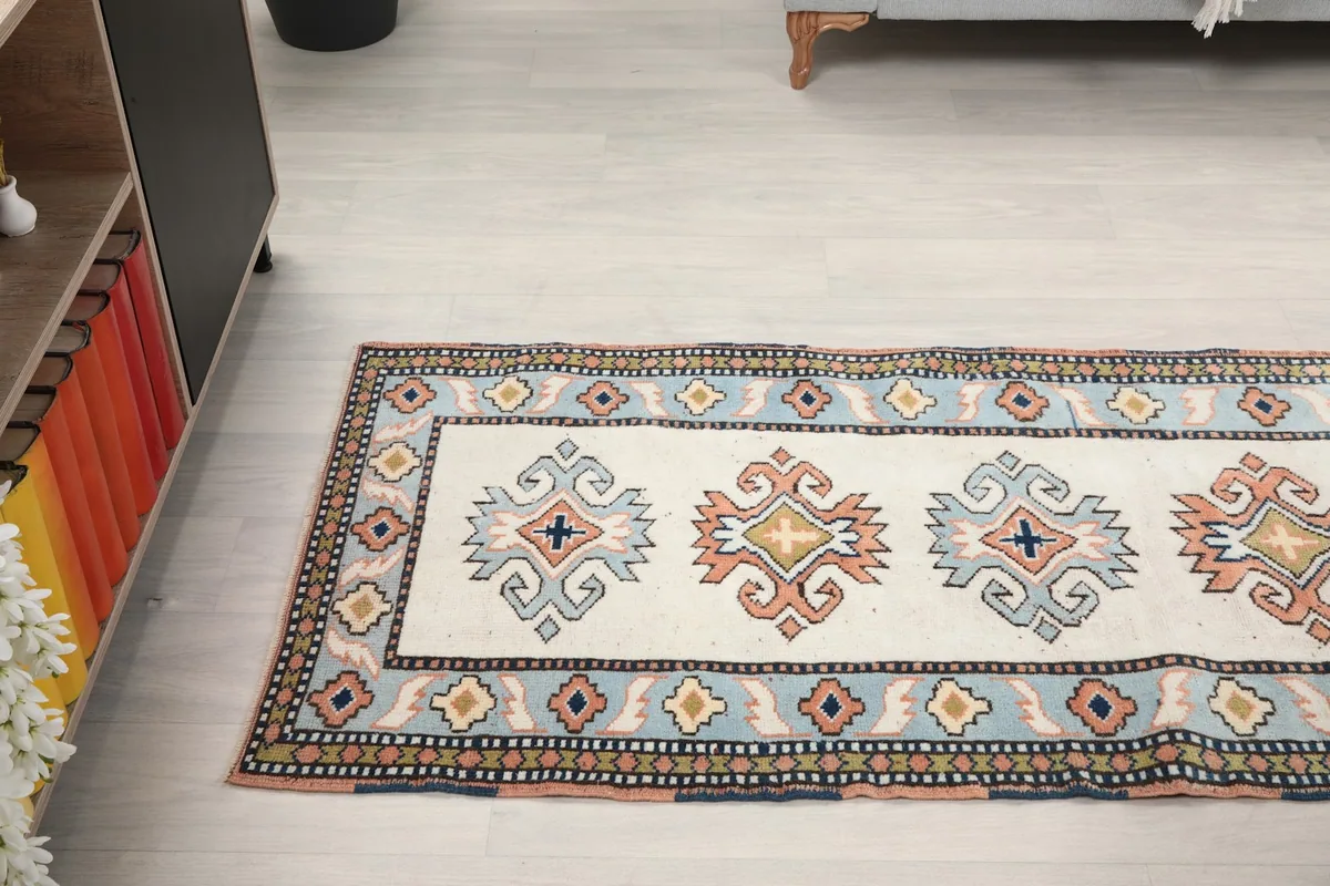 Long view of the runner rug laid out, seen from an angle in a room