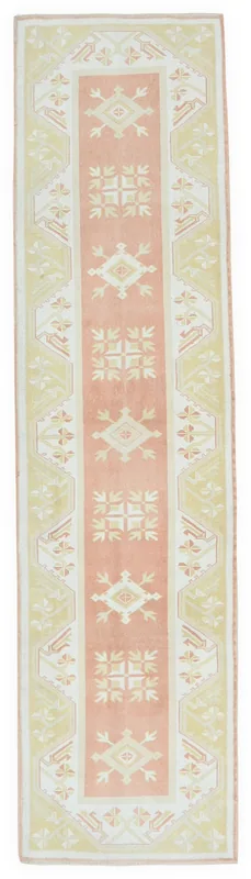 Full top view of the vintage Anatolian runner rug with rose and beige geometric patterns.