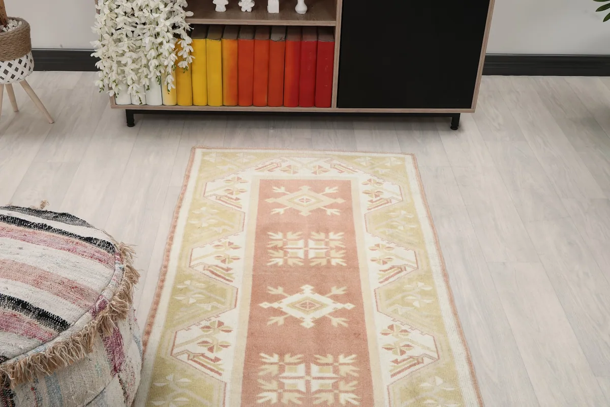 Overhead angled shot of the runner rug, focusing on the central design and colors.
