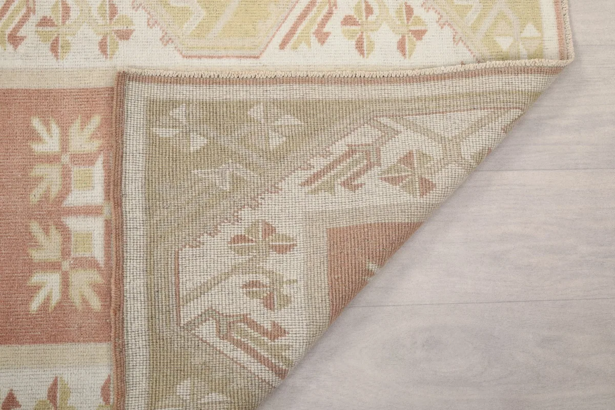Close-up of the rug's back, showing the consistent knotting and structure.