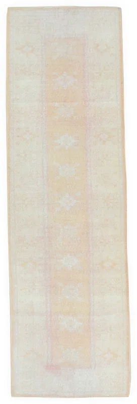 Full overhead view of the beige and rose vintage Anatolian runner