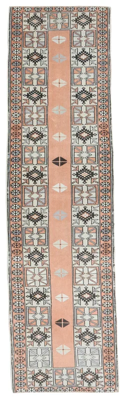 Full top view of the 2'6" x 9'5" vintage Anatolian runner on a white background