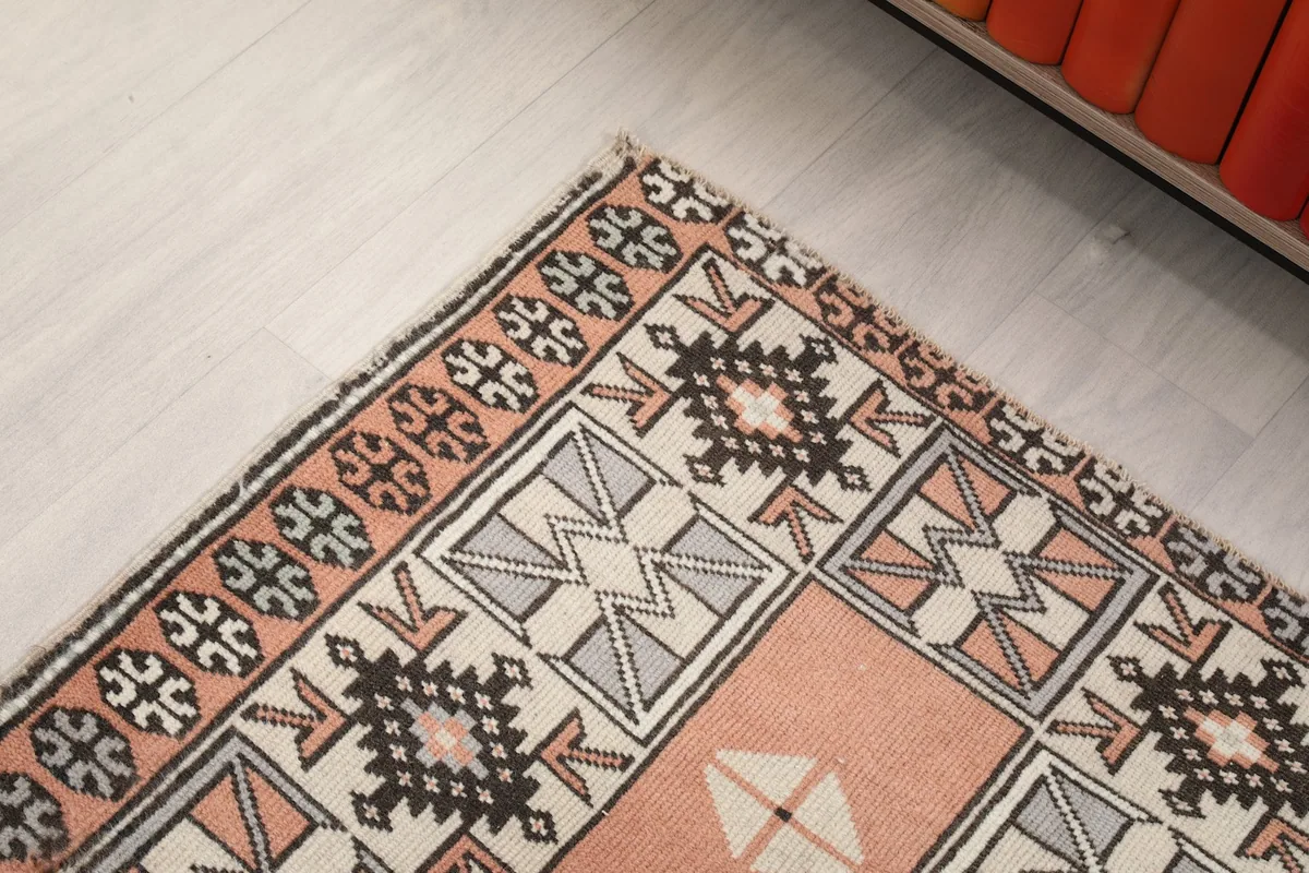 Close-up of the runner's border design and corner with intricate geometric elements
